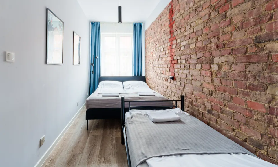 Bedroom with brick wall