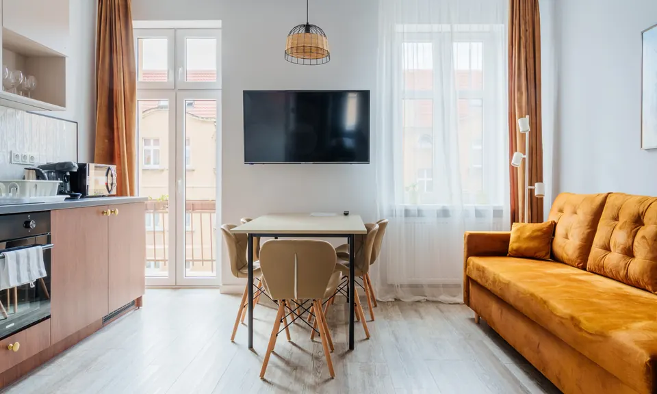 Living room with TV, table and sofa