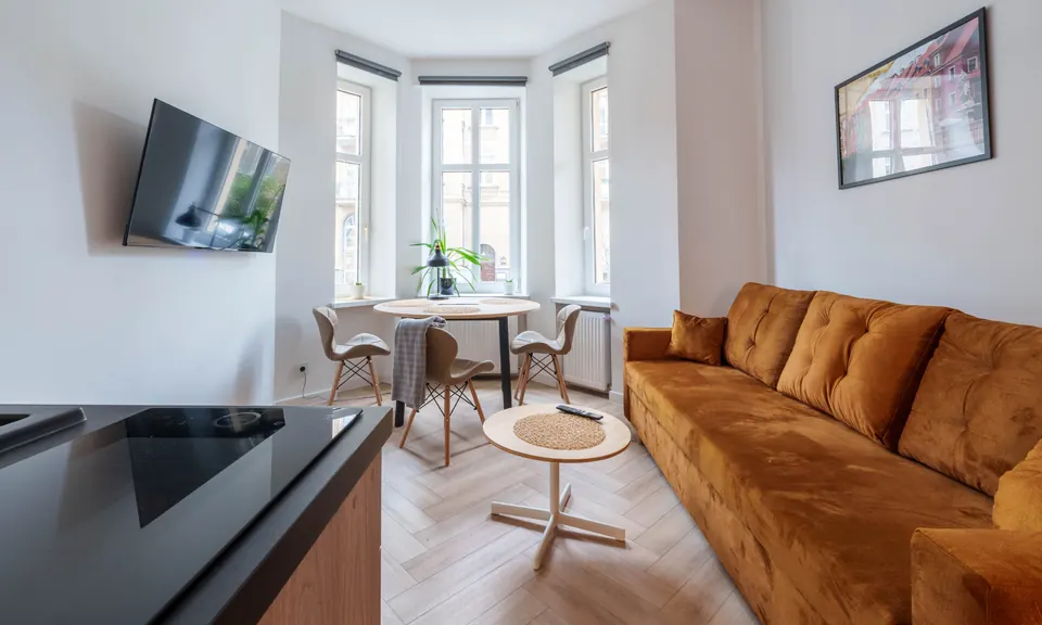 Living room with TV, table and sofa