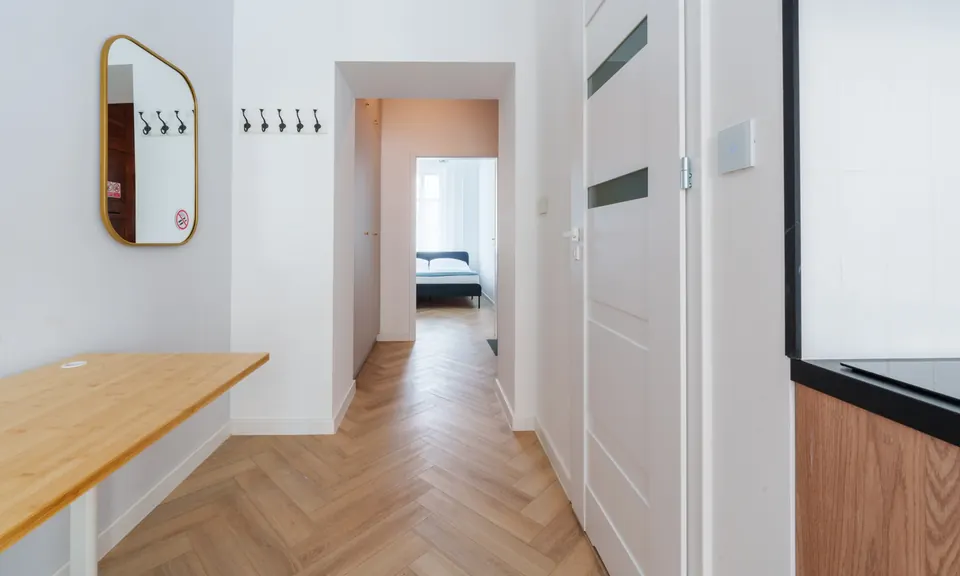 Hallway with mirror and coat hooks